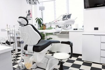 Modern dental clinic interior with patient chair, professional equipment and clean minimalist medical environment