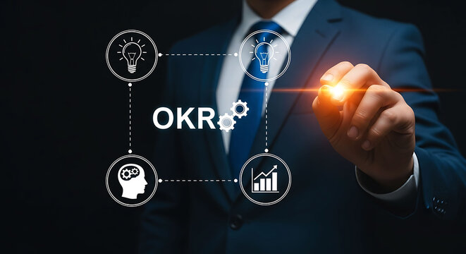Businessman pointing at OKR management framework and business strategy