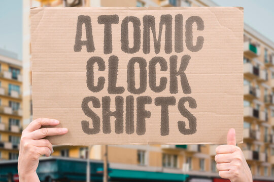 "Atomic Clock Shifts" Nuclear timer changes position yearly. ATOMIC. CLOCK. SHIFTS. TIMER. POSITION.