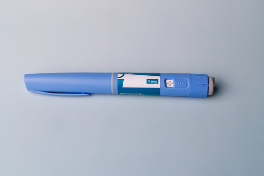 Modern semaglutide GLP-1 injection pens for diabetes and obesity management on a professional blue gradient background for pharma.