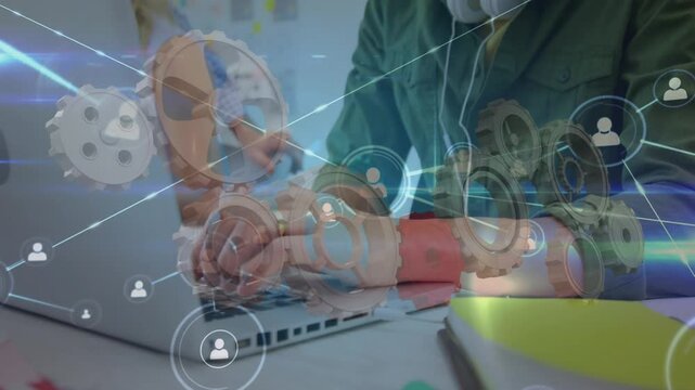 Network of profile icons over asian man using laptop at office