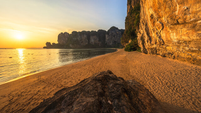 sunset at tonsai beach on tropical island railay in krabi in thailand