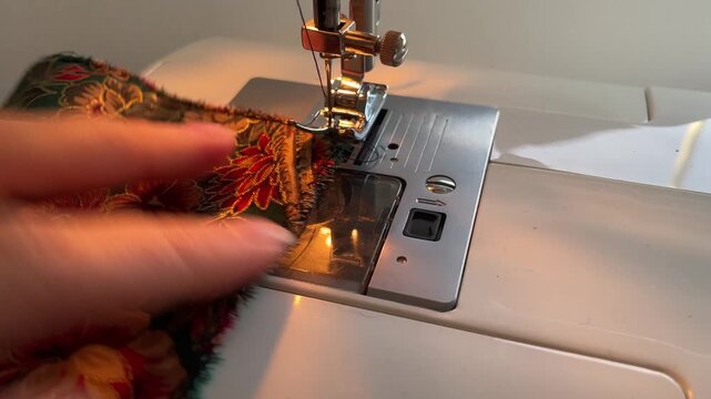 close up of a sewing machine sewing zigzag