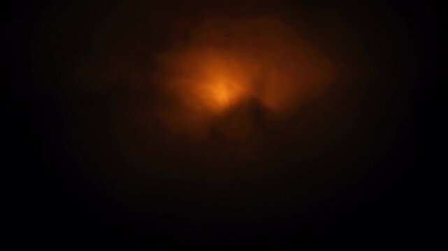 Animation spooky halloween background with dark fog and glowing orange light.