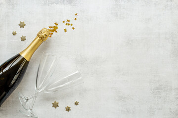 Christmas decoration flat lay with champagne bottle and two glasses, top view © 9dreamstudio