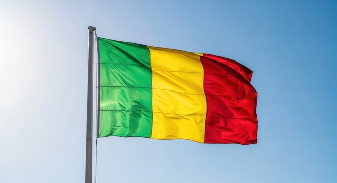 Mali Flag Waving Against Clear Blue Sky
