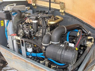 Close-up of an industrial vehicle engine showcases the intricate mechanical and engineering design.