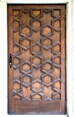 Old medieval decorated wooden door