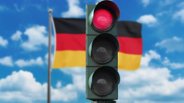 German flag and a red traffic light symbolizing the stop when entering Germany