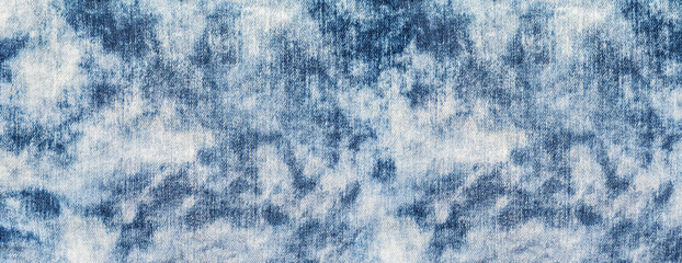Naklejka premium Acid wash denim fabric pattern with bleached blue texture