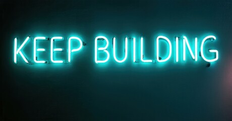 Fototapeta premium Bright neon sign displays positive message. Turquoise glow contrasts dark background. Simple typography, motivational quote visible.