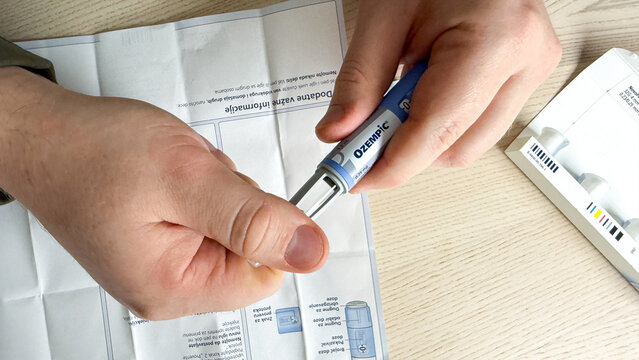 Injecting life into wellness on World Diabetes Day, thoughtful Caucasian male handles Ozempic pen, embracing modern miracles Ozempic, GLP-1, Semaglutide, January 5, 2026, Subotica, Serbia