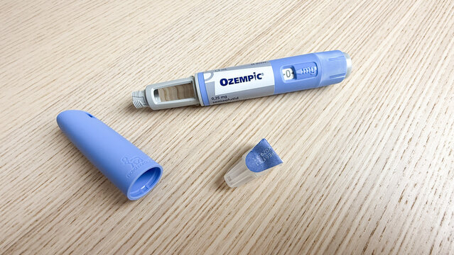 Sleek Ozempic pen whispers health alchemy amid woodgrain tenderness, echoing Dia de la Vida vibrations and modern wellness rituals Ozempic, GLP 1, Semaglutide, January 5 2026, Subotica, Serbia