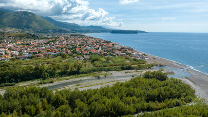 Aerial view of Tortora Marina, located in the province of Cosenza, Calabria, Italy. It is a small coastal town on the Tyrrhenian Sea and a summer tourist destination. The sea stretches to the horizon.