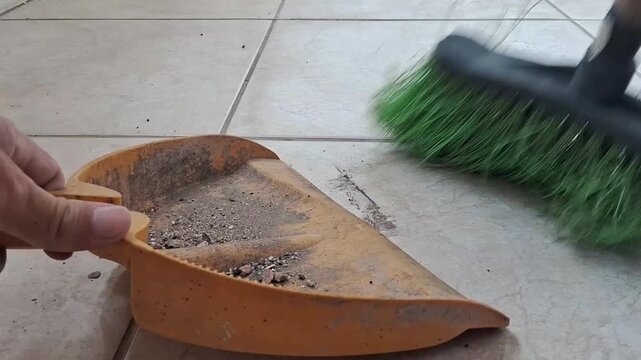 Broom sweeping the floor