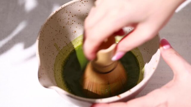 Matcha Preparation. Ceramic bowls and bamboo whisk for preparing matcha tea