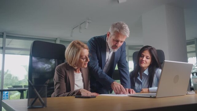 Unhappy supervisor addressing poor business outcomes during a stressful team meeting