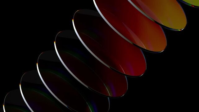 Loop 3d animation. Translucent glass blocks spin and rotate on black background, round lenses.