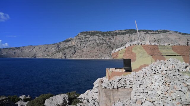 Abandoned coastal bunker near Panormitis Monastery in Symi
