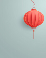 Obraz premium A vibrant red Chinese lantern hanging against a soft blue background