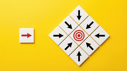 Obraz premium Strategic decision making and unique direction concept with arrows pointing toward target on bright yellow background.