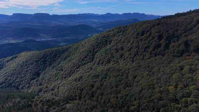 Aerial view from a drone of Mount Coliza (897 m) (Kolitza in Basque) with the chapel of San Sebasti&aacute;n and San Roque in the Ordunte Mountains in Valmaseda. Bizkaia, Basque Country, Spain.