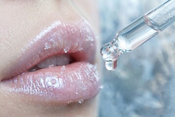 Fototapeta premium Photorealistic close up of glistening lips adorned with crystalline sugar droplets, complemented by a clear dropper releasing revitalizing serum, evoking a sense of allure and skin vitality