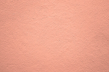 Fototapeta premium Wall Texture light pink or soft red color cement texture background light yellow cement texture Yellow Brown cement stucco plaster peach fuzz wall backdrop image Trendy 2024 color colour