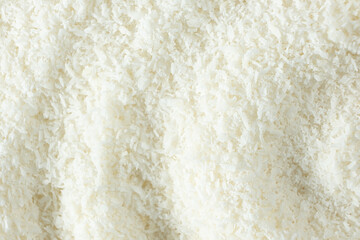 Obraz premium Background texture of white desiccated coconut flakes top view