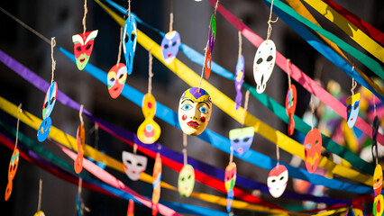 Colorful hanging carnival masks and ribbons as festive Purim decorations symbolizing joy creativity and Jewish celebration
