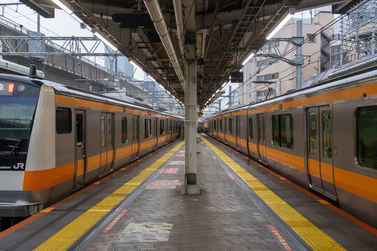 Train platform in Kanda station, Tokyo. Kanda offers a unique atmosphere, blending tradition and modernity