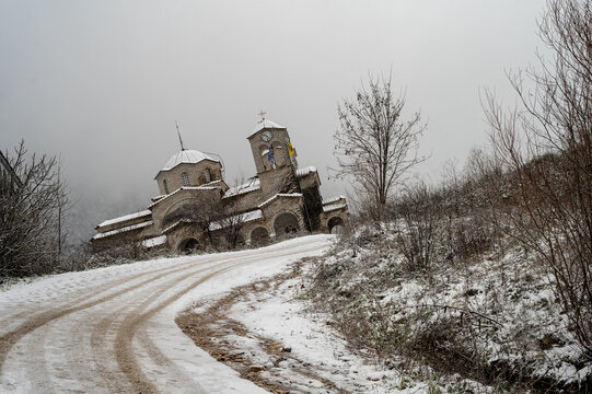 The leaning church of Ropoto Trikala Greek ghost village sinking in the mountains covered in snow