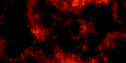 Obraz premium Abstract grunge red and black powder explosion cloud on black background. dark red smoke Like cloud wave effect on black. dark fire flame grunge texture background. toned fiery red sky.