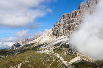 Dolomites landscape: Tre Cime di Lavaredo hidden in mist from Auronzo Refuge path