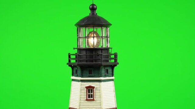 Miniature lighthouse model on green screen background for versatile use
