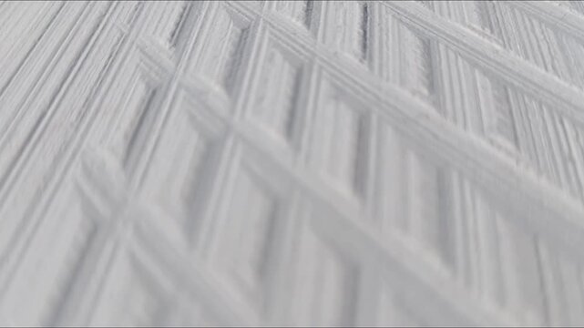 White abstract geometric texture with diagonal parallel ridges and minimalist pattern