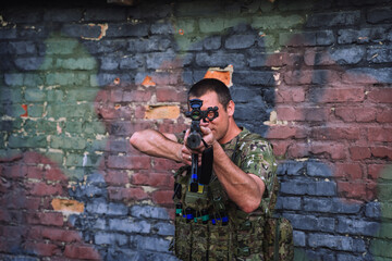 Fototapeta premium Ukrainian soldier aiming rifle during war against invasion