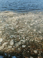 Ice floes in river. Floating ice pieces on river water in winter daylight. Concept of natural winter background with copy space for banner, website header, climate content.