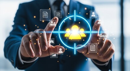 Businessman hand holding virtual target icon with people group, human resources recruitment concept and customer audience targeting strategy in blurred office.