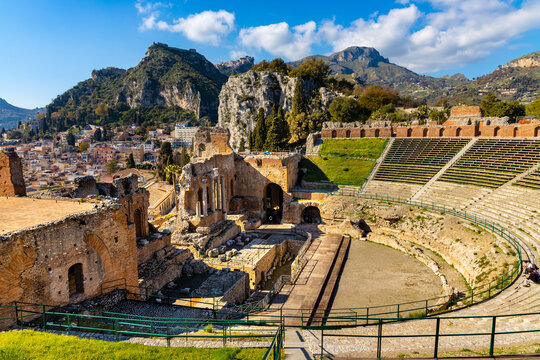 Greek and Roman period Teatro antico Ancient Theatre with cavea seating auditorium in Taormina at Ioanian sea shore of Sicily in Italy