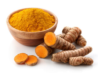 Bowl of turmeric powder and fresh whole and sliced root