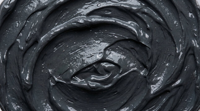 Close-up texture of grey cosmetic clay mask smeared on surface. Matte charcoal mud face mask background. Spa and wellness concept. Generative AI.