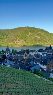Panoramic view of Bacharach. Rhine valley, Germany. Bacharach, located in the Rhine Valley, Germany, is depicted with its traditional half-timbered houses and slate-roofed structures. 