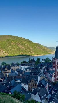 Panoramic view of Bacharach. Rhine valley, Germany. Bacharach, located in the Rhine Valley, Germany, is depicted with its traditional half-timbered houses and slate-roofed structures. 