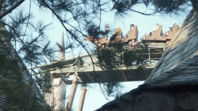 Cinematic upward view captures coaster train moving slowly near top of lift or curve, steel structure and maintenance platform filling frame while bright daylight emphasizes engineering details.