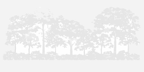 Fototapeta premium Silhouetted forest landscape with dense tree line and subtle sky detail