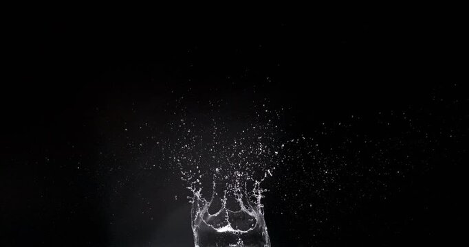 This water splash displays mesmerizing droplets from an object falling into water, perfect for enhancing motion graphics and visual effects in projects, adding a dynamic touch to creativity