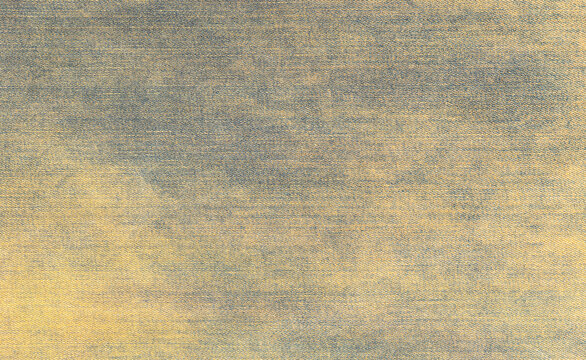 Washed blue and yellow denim fabric surface texture