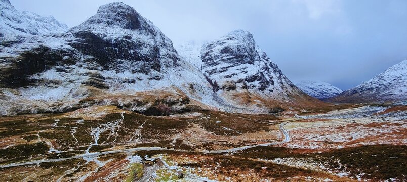 Glencoe valley and snow covered mountains in Scotland