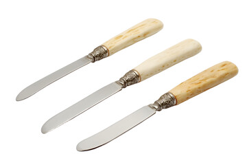 Set of carved bonehandled butter knives isolated on white background
